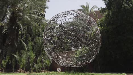 a ball made out of bycicle wheels in nature | slowmotion