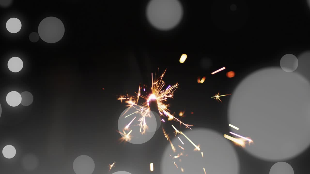 Igniting handheld sparkler pulsing core while emitting sparks radiating outward for vibrant display