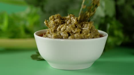 the sauce is put with a spoon in the bowl.