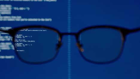 coding on blue screen computer system thru eye glasses insight vision in data scientist programming ai for machine learning operation, modeling predictive analytics, data engineering it skill concept.