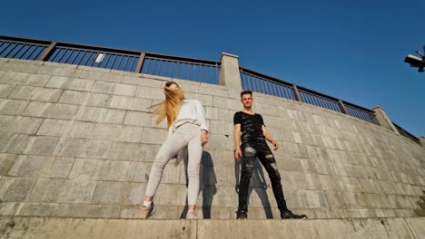 carefree and free youth. beautiful young and professional couple dancing outdoor
