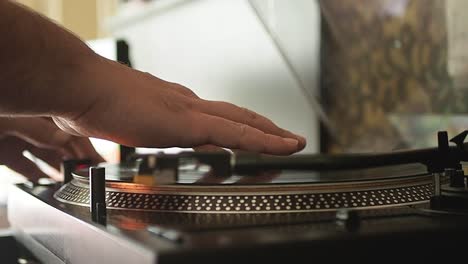 Close-up-of-the-stylus-getting-put-onto-the-record