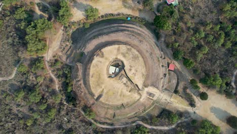 rotated drone shot of core cuicuilco pyramid in mexico city at morning