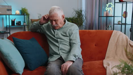 sad lonely senior man at home suffers from bankruptcy sick depressed feeling bad burnout crisis
