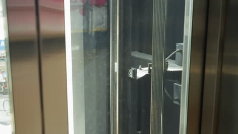 close-up view of the inner mechanisms of an elevator shaft, showcasing the cables and machinery in detail