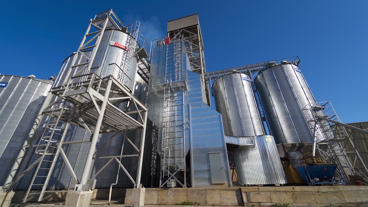 Modern industrial grain elevator. Agricultural grain elevator building for grain storage
