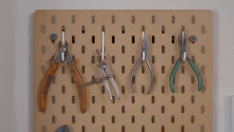organized workshop tools on pegboard