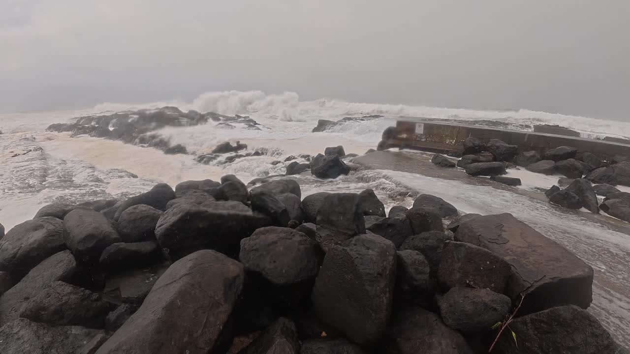 Crashing Waves On Rocky Coast On Stormy Weather. Cyclone Alfred At Snapper Rocks In Queensland, Australia. panning shot