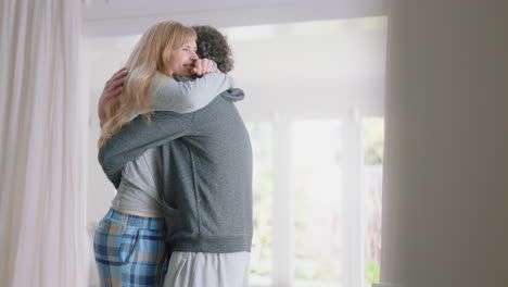happy-couple-hugging-excited-woman-embracing-boyfriend-sharing-good-news-enjoying-romantic-relationship-at-home-4k-footage