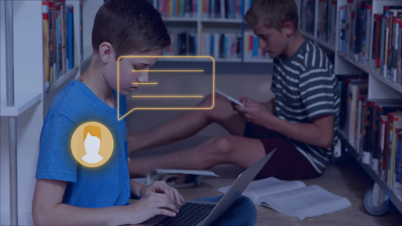 Two boys studying with laptop and books, chat icon animation over scene