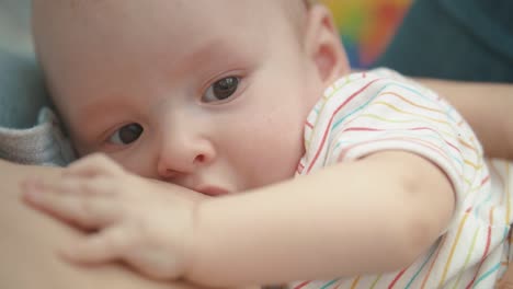 breast feeding baby portrait. motherhood love. lovely baby breast feeding