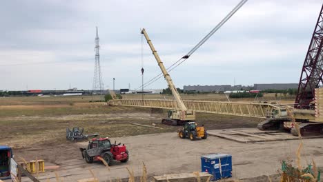 Workers-are-trying-to-couple-the-crane-pieces-to-each-other-so-they-can-continue-to-construct-the-wind-turbine