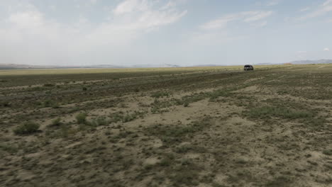 Offroad-jeep-driving-through-arid-Vashlovani-steppe-plain-in-Georgia