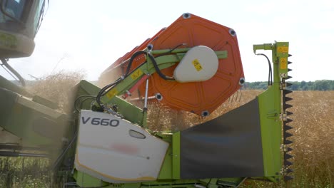 Close-up-shot-of-harvester-threshing-grain