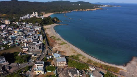 osatsu town and chidorigahama beach, aerial view on warm sunny day 4k