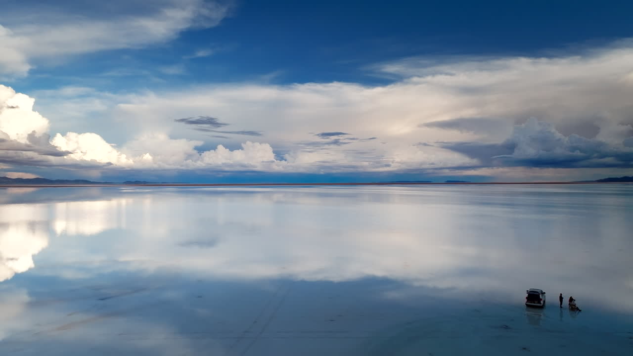 Ecotourism adventure exploring reflections of Uyuni salt flats, Bolivia. Aerial