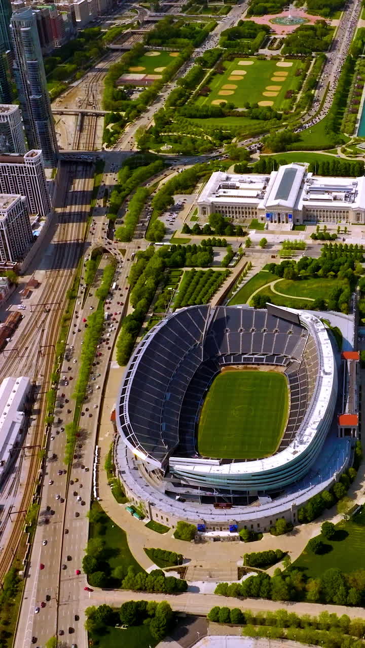 Soldier Field, Chicago Bears stadium, Chicago, Illinois. Great stadium in the green area beside busy roads and yacht club. Top view. Vertical video
