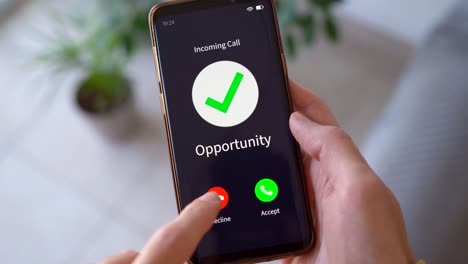 person holding mobile phone showing incoming call with caller id opportunity. - closeup shot