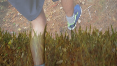 animation of grass over legs of caucasian man running