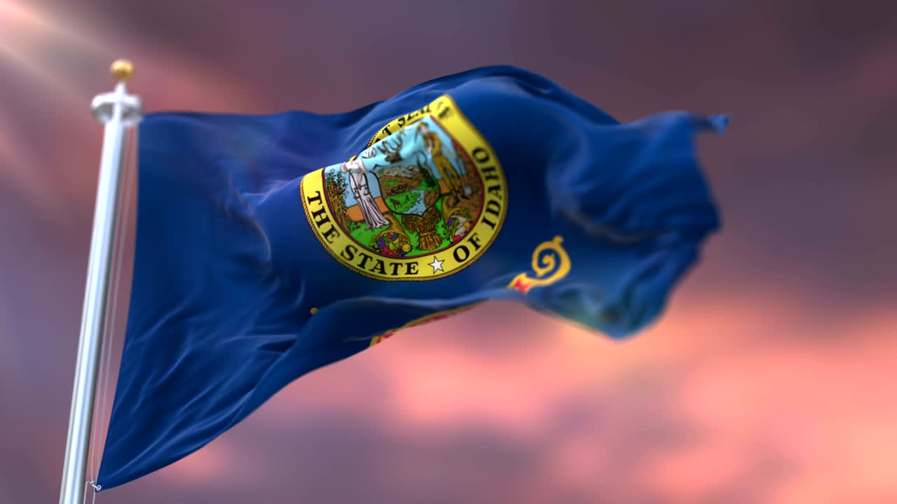bandera del estado de idaho al atardecer, región noroeste de los estados unidos - bucle