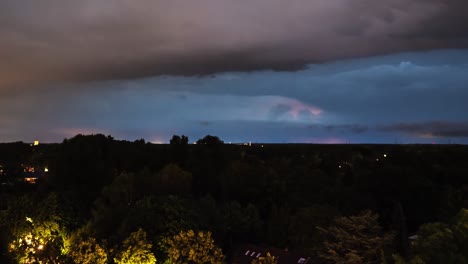 Time-lapse-sequence-of-thunderstorm-lightning-at-night-over-a-village