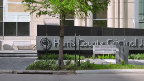 establishing shot of the harris county criminal justice center in houston, texas