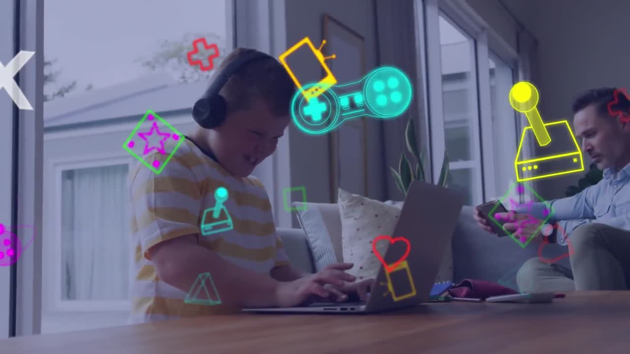 animación de iconos de juegos sobre padre caucásico con hijo usando computadora portátil