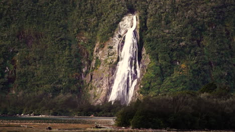 shot of beautiful lady bowens falls in milford sound in fiordland national park, south island, southern alps, new zealand at daytime