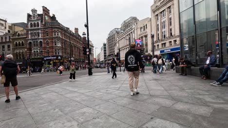 pedestrians walking in a bustling london street