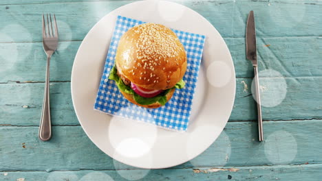 animation of bokeh over burger on plate