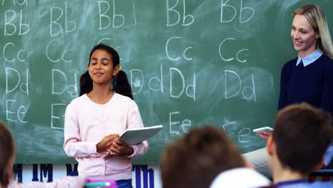 schoolgirl taking lesson of her classmates