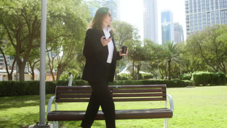 Woman-getting-up-from-the-bench-of-a-park