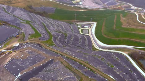 Aerial-Flying-Over-Hillside-Landfill-In-Galicia