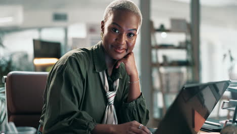 woman working on laptop in modern office