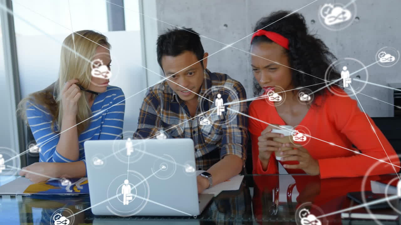 Animation of network of digital icons against team of diverse colleagues discussing at office