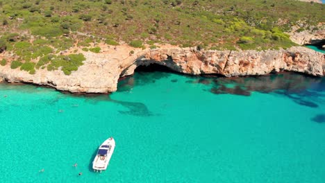 aerial footage on cala varques beach, mallorca. a hidden paradise with crystal clear water.