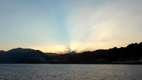 Sunset-Backlit-Mountains-On-Red-Sea-Coast-In-Dahab,-Egypt