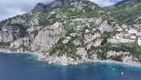 amalfi coast at positano in salerno italy. coastal city. waterfront landscape. amalfi coast at positano in salerno italy. beach scenery. medieval buildings. amalfi coast skyline