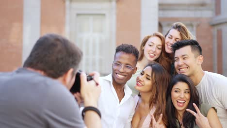 diverse group of friends posing for a photo outdoors