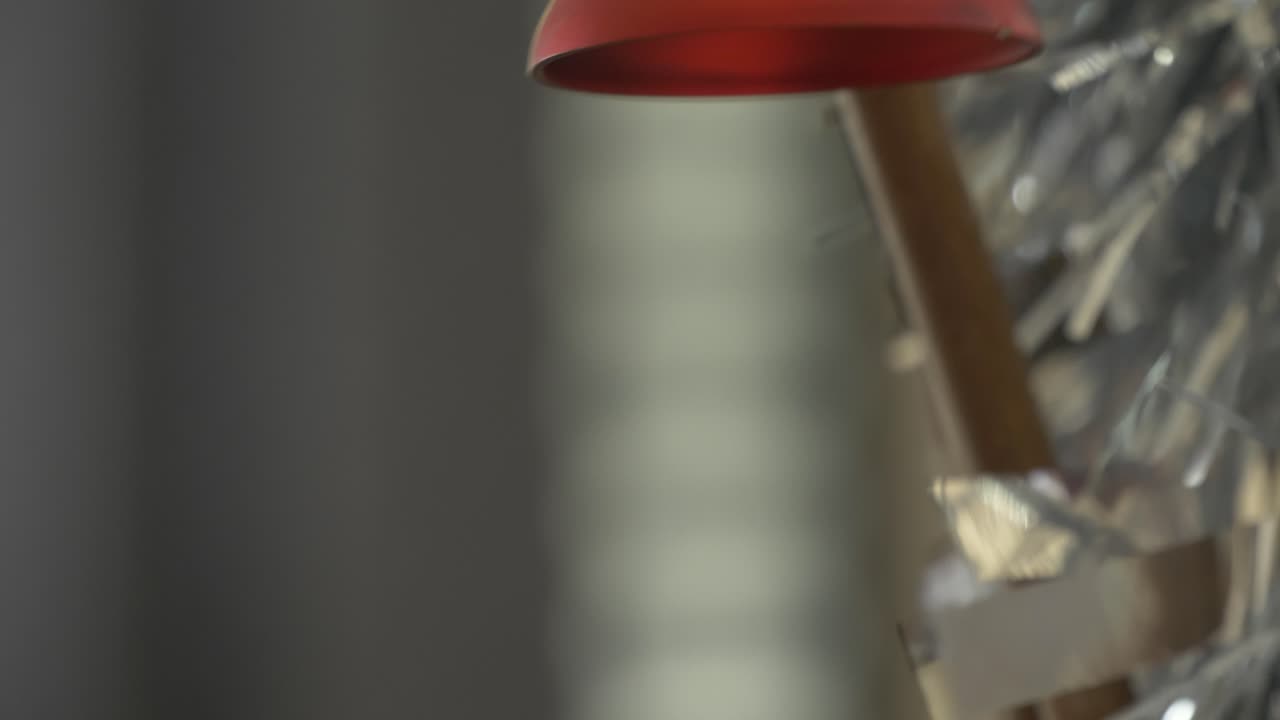 close up on a christmas bauble shaped as a bell zooming in