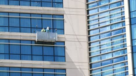 window cleaning crew on high-rise building