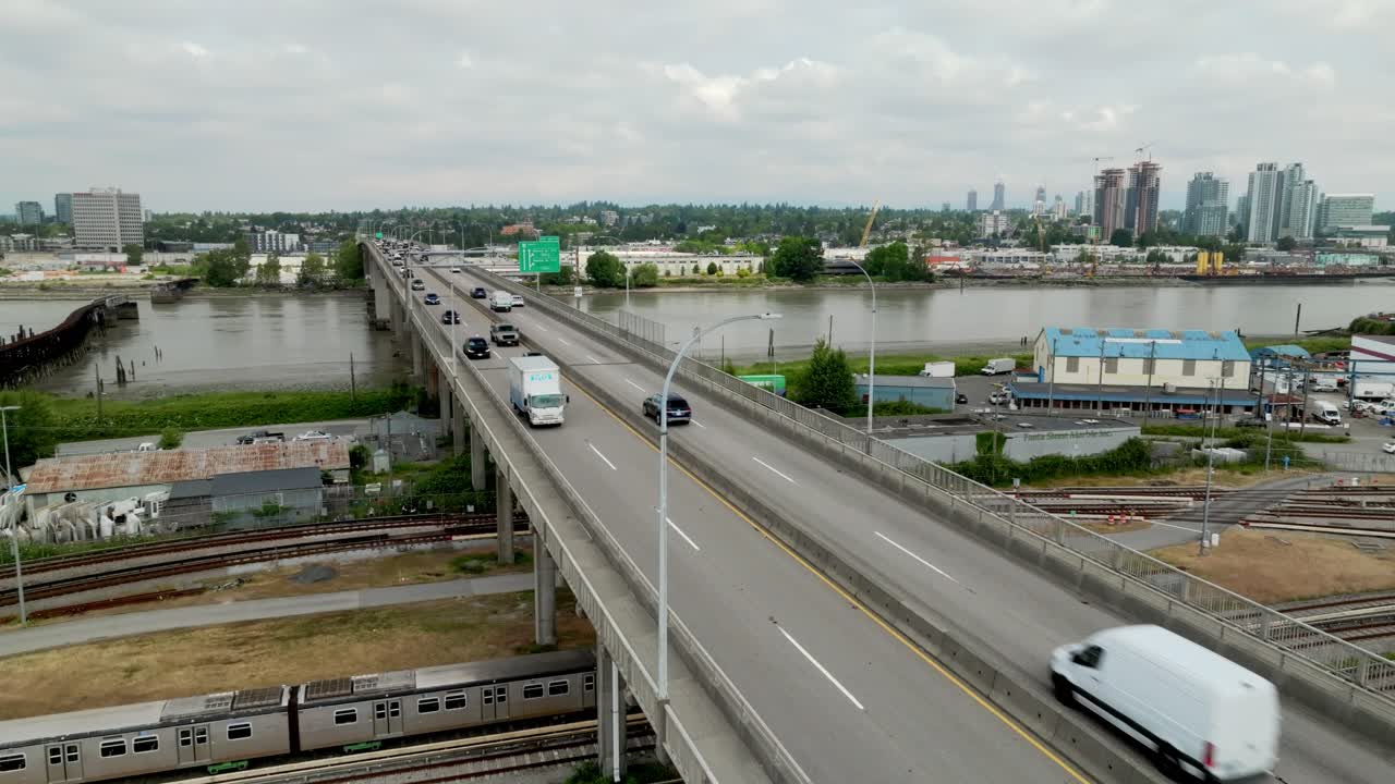 Cars are Traversing the Bridge Near Bridgeport Along River Drive in Richmond, British Columbia, Canada - Static Shot
