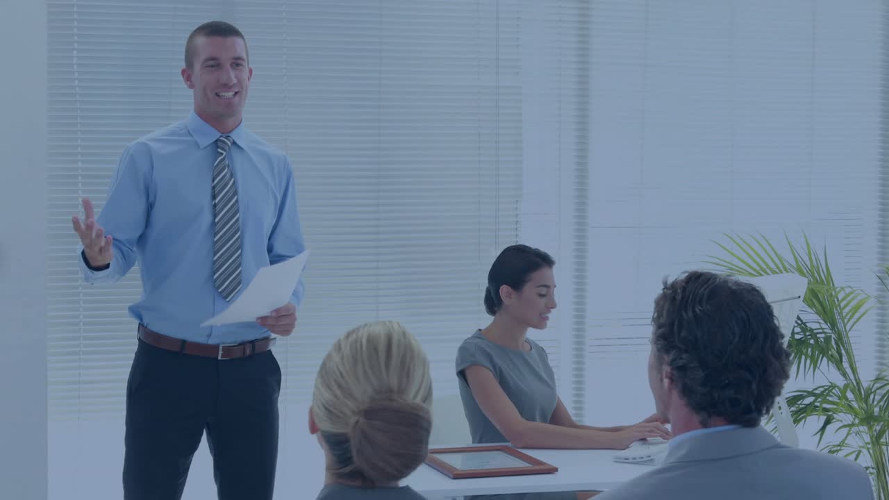 Host gesturing with pages starting line or bar or map moving right across room showing business data