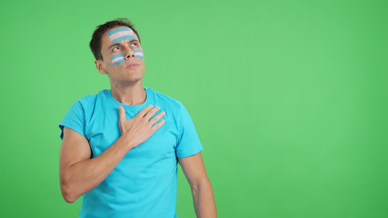 Man listening to the Argentina national anthem with solemnity