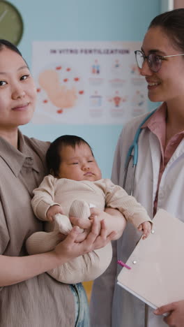 mother and baby with doctor in clinic