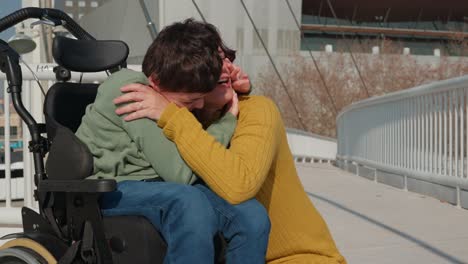 mother and son sharing a heartfelt moment in wheelchair