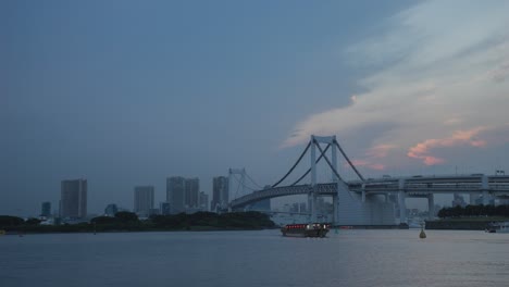 tokyo rainbow bridge at dusk/night