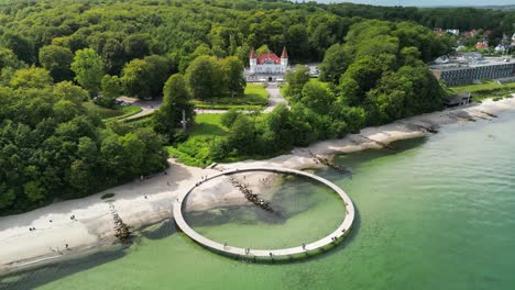 the infinite bridge aerial with varna castle beachside, aarhus, denmark