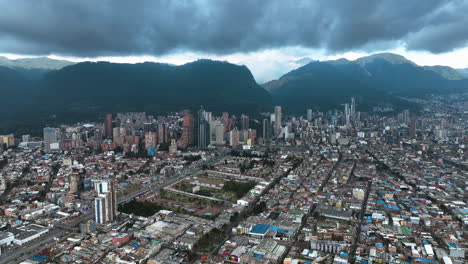 high altitude aerial view of the bogota city skyline with rainy clouds in colombia