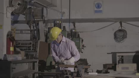 man hard worked and sawing steel. worker using cutter circular metal has lighting spark. concept of engineering, workshop, industry, manufacture and business.